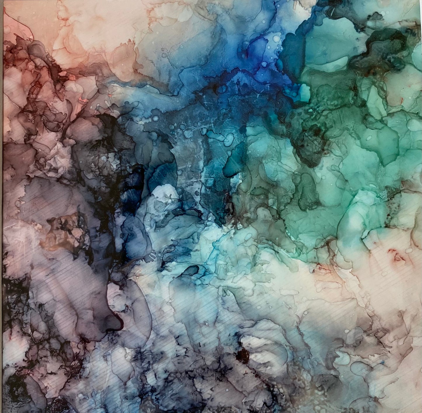 Tavla i alkoholbläck. Vit ram 22x22 cm. Målningen med passepartout 14x14 cm.