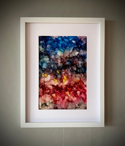 Tavla i alkoholbläck. Vit ram 30x40 cm. Målningen med passepartout 20x30 cm.